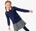 Girl in uniform wearing Primary French Terry Sweater - Navy. Available at www.tenlittle.com