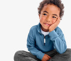 Boy wearing Primary French Terry Quarter Zip Sweatshirt - Moonlight. Available at www.tenlittle.com