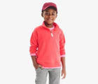 Boy wearing Primary French Terry Quarter Zip Sweatshirt - Strawberry. Available at www.tenlittle.com
