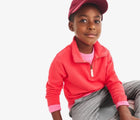 Boy wearing Primary French Terry Quarter Zip Sweatshirt - Strawberry. Available at www.tenlittle.com