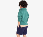 Boy wearing Primary French Terry Quarter Zip Sweatshirt - Sunwashed Teal. Available at www.tenlittle.com