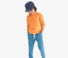 Boy wearing Primary French Terry Sweatpants - Moonlight. Available at www.tenlittle.com