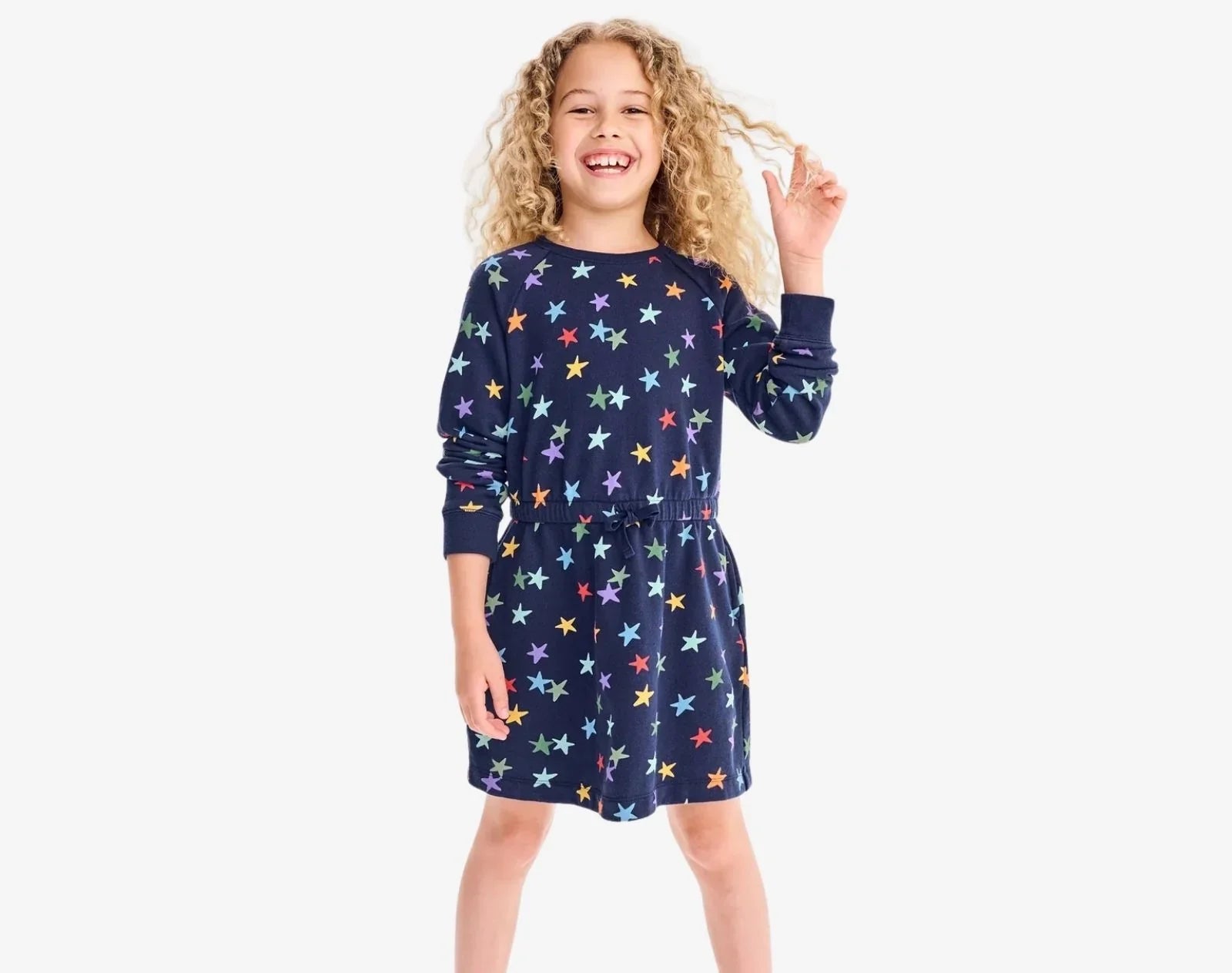 Child wearing Primary Sweatshirt Dress - Rainbow Stars - Navy / Confetti Stars. Available at www.tenlittle.com