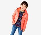 Child wearing Primary - Lightweight Puffer Jacket - Clementine - Available at www.tenlittle.com