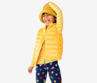 Child wearing Primary - Lightweight Puffer Vest - Mustard - Available at www.tenlittle.com