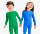 Kids holding hands wearing Primary Long Sleeve PJ Set - Grass and Blueberry. Available at www.tenlittle.com