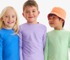 Children wearing Primary Long Sleeve Rash Guard - Blueberry, Iris, Pear. Available at www.tenlittle.com
