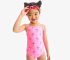 Child wearing Primary One-Piece Swimsuit - Flamingos - Pink Lemonade Flamingos. Available at www.tenlittle.com