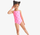 Child wearing Primary One-Piece Swimsuit - Flamingos - Pink Lemonade Flamingos. Available at www.tenlittle.com