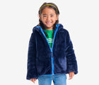 Girl wearing Primary - Reversible Fleece Puffer Jacket - Blueberry/Navy - Available at www.tenlittle.com