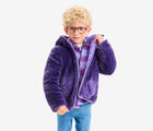 Boy wearing Primary - Reversible Fleece Puffer Jacket - Violet/Grape - Available at www.tenlittle.com