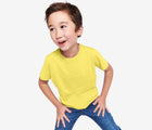 Boy wearing Primary Short Sleeve Classic Tee in Banana - 3 Pack - Banana Mix. Available at www.tenlittle.com