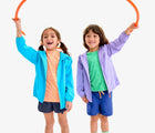 Child playing wearing Primary Running Shorts - Navy. Available at www.tenlittle.com