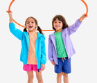 Kids playing with hula hoop wearing Primary StayCool Stretch Shorts - Fuchsia and Cobalt. Available at www.tenlittle.com