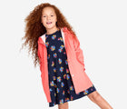 Girl wearing Primary - Sustainable Raincoat - Watermelon - Available at www.tenlittle.com