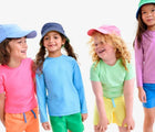 Kids wearing Primary Swim Trunks - 2 Pack - Assorted Colors. Available at www.tenlittle.com
