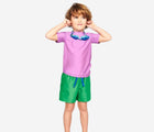 Child wearing Primary Swim Trunks in Green Apple - 2 Pack - Green Apple / Blueberry. Available at www.tenlittle.com
