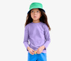 Child wearing Primary Long Sleeve Rash Guard - Iris. Available at www.tenlittle.com
