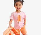 Child wearing Primary Track Shorts - Goldfish. Available at www.tenlittle.com