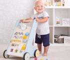 Boy playing with Bigjigs Activity Walker. Available from www.tenlittle.com.