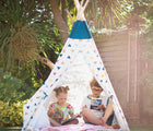Children reading in Bigjigs Teepee in the backyard. Available from www.tenlittle.com.