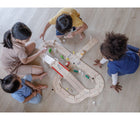 Kids playing Plan Toys Road System - Available at www.tenlittle.com