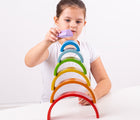 Girl playing with Bigjigs Wooden Stacking Rainbow. Available from www.tenlittle.com.