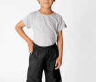 Child Wearing Therm Kids Eco Waterproof & Windproof Splash Pant - Black. Available at www.tenlittle.com.