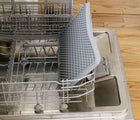 ezpz Drying Rack in gray inside dishwasher. Available at tenlittle.com