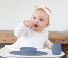 Baby Eating in Ezpz First Food Set - Indigo.  Available at www.tenlittle.com