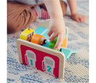 Child playing with Djeco Wooden Mini Automobile Set. Available from tenlittle.com