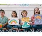 Children holding artwork they created with the Do-A-Dot Art Juicy Fruit Dot Art Markers - Set of 6. Available from tenlittle.com
