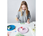 Child playing with Eco-kids Milk Paint. Available from tenlittle.com