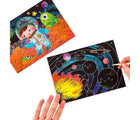 Child's hands using Ooly Scratch & Scribble - Space. Available from tenlittle.com