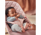 Child sitting in BabyBjörn Bouncer Bliss Cotton in dusty pink classic quilt. Available from tenlittle.com