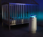 Béaba Nursery Air Purifier on a balcony outside during night time. Available from tenlittle.com