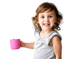 Child holding pink cup from Ekobo Bamboo Cup Set. Available from tenlittle.com