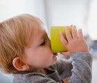 Child drinking out of cup from Ekobo Bamboo Cup Set. Available from tenlittle.com