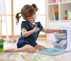 Girl playing with Nothing But Fun My First Dishwasher in playroom. Available from tenlittle.com