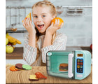 Child playing with Nothing But Fun My First Microwave at a table. Available from tenlittle.com