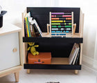 Nico & Yeye Modern Kids Bookcase in black with toys on it, in a playroom. Available from tenlittle.com