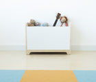 Nico & Yeye Cubbie Chest in a playroom with toys in it. Available from tenlittle.com