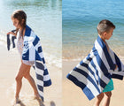 Kids using Dock & Bay Navy Blue Quick Dry Beach Towel on the beach