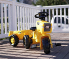 Kettler CAT 3-wheeled pedal tractor with trailer on a porch