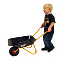Boy pushing Kettler CAT wheelbarrow