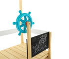 Close up view of captain's wheel and blackboard on TP Toys Pirate Ship Play Boat & Sandbox. Available from tenlittle.com
