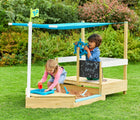 Two children playing on TP Toys Pirate Ship Play Boat & Sandbox outside in the yard. Available from tenlittle.com
