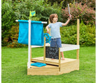 Child playing on TP Toys Pirate Ship Play Boat & Sandbox outside in the yard. Available from tenlittle.com