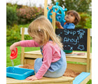 Two children playing with TP Toys Pirate Ship Play Boat & Sandbox outside in the yard. Available from tenlittle.com
