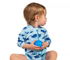 Child wearing Jan & Jul Long Sleeve UV Sun Suit in Whale, holding a blue ball. Available from tenlittle.com